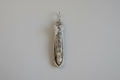 Wire wrapped fossil with clear quartz
